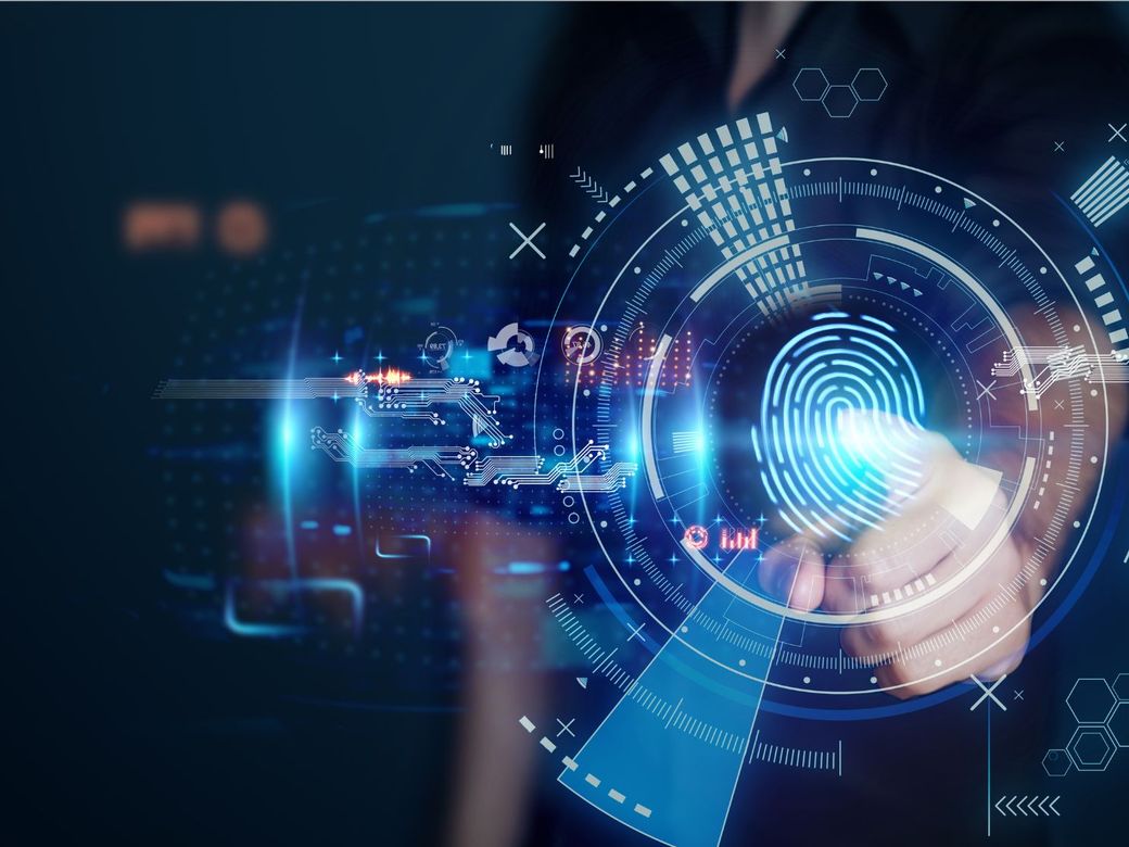 Hand pressing a digital fingerprint access control screen