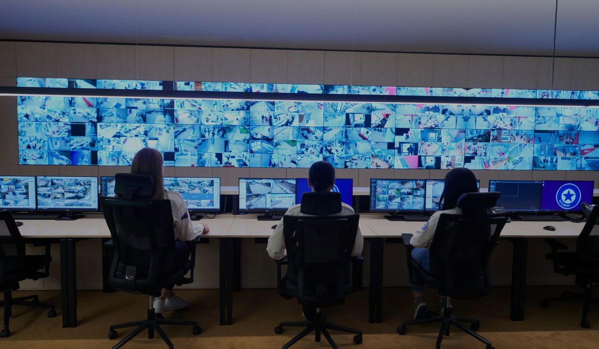 Monitoring agent watching live security camera feeds